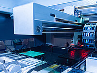 Positioning system for PCB production with linear gantry, cable chain and circuit board fixture